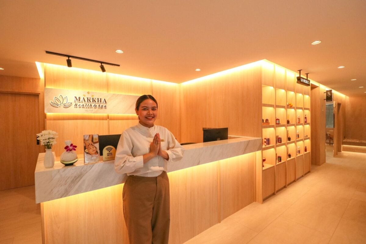 A staff member welcoming guests at Makkha Health & Spa