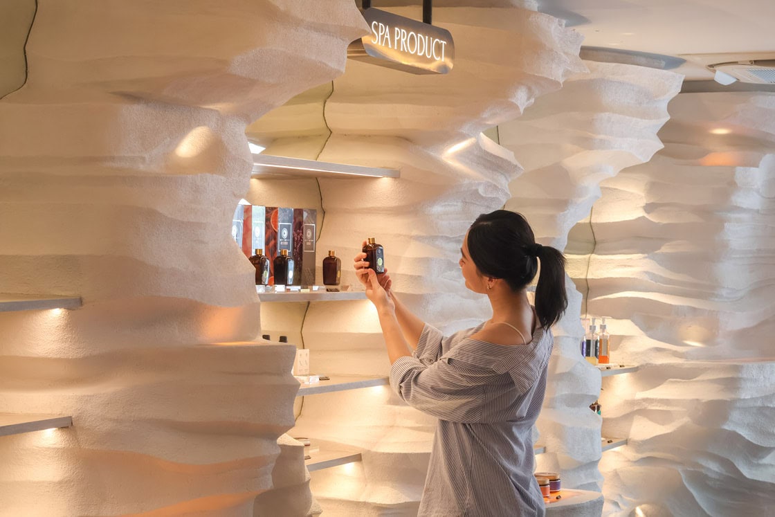 Woman exploring natural spa products at Makkha Health & Spa