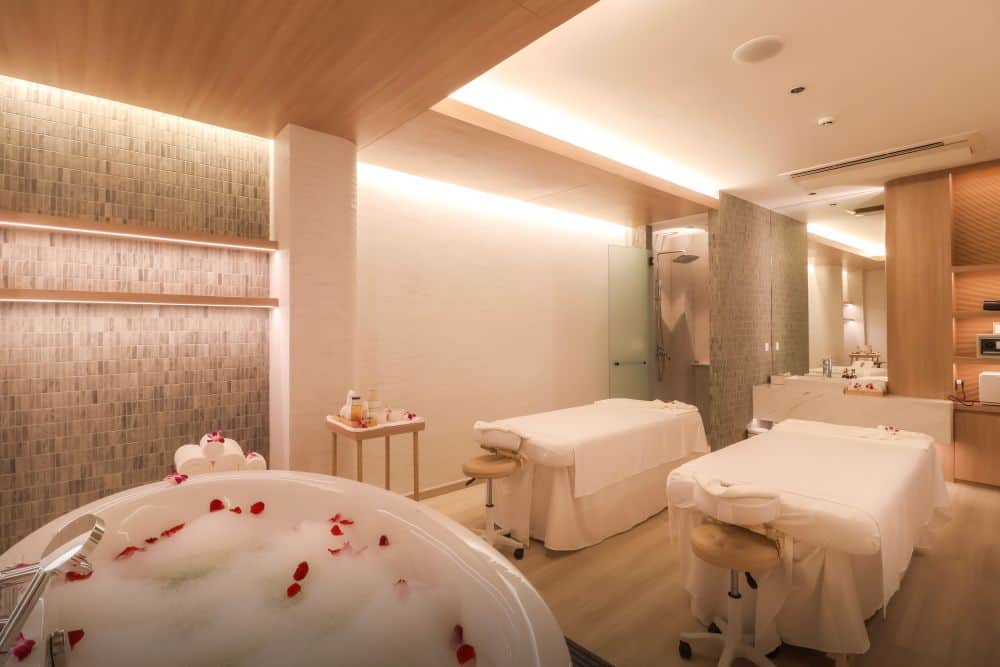 Aroma oil massage beds for a couple’s massage therapy session in Makkha Health & Spa