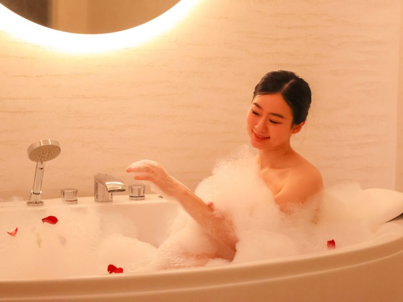 Relaxing woman enjoying a bubble bath at Makkha Spa in Chiangmai, offering the best spa experience with soothing ambiance and luxurious treatments.