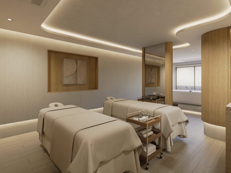 Relaxing massage therapy room at Makkha Spa in Chiangmai with two massage beds, soft lighting, and calming decor for a tranquil spa experience.