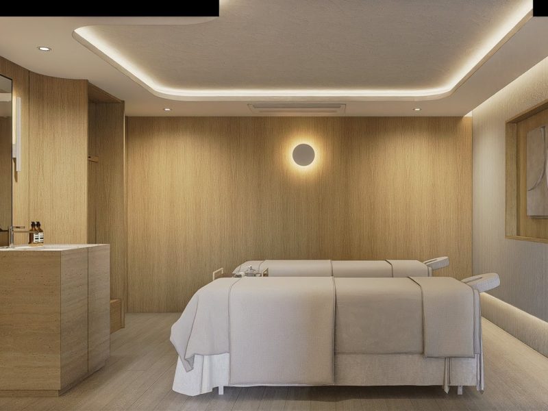 Relaxing massage room at Makkha Spa in Chiangmai with modern decor, soft lighting, and comfortable treatment beds for a soothing spa experience.