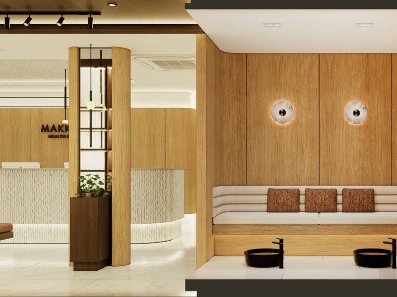 Modern spa reception area at Makkha Spa in Chiangmai with warm wooden accents and comfortable seating for guests.