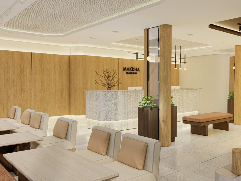 Relaxing spa lounge area with modern wooden decor and comfortable seating at Makkha Spa in Chiangmai, offering a tranquil environment for guests seeking rejuvenation and wellness treatments.