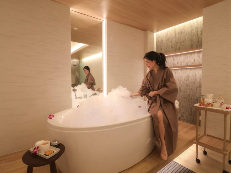 Relaxing women enjoying a bubble bath at Makkha Spa, Chiangmai's top wellness destination for luxurious spa treatments and authentic Thai massage in a serene, modern setting.